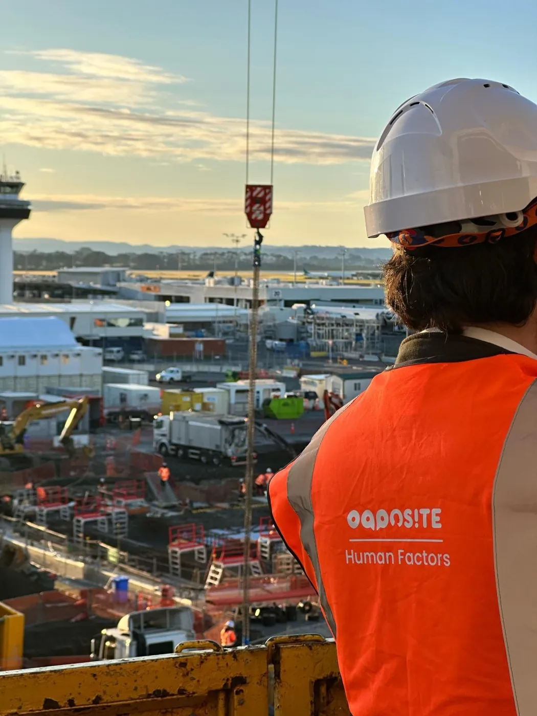 An Opposite Human Factors specialist in hi-vis on a construction site